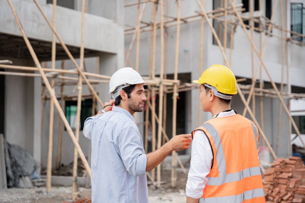 The engineer manager and foremen discussed the site projects on the construction site.